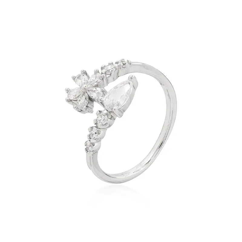 HALF-OPEN RING ONE SIDE DROP 4 MM THREE POINTS OF LIGHT AND THE OTHER FLOWER FIVE PETALS TWO POINTS OF LIGHT RHODIUM/CRYSTAL/WHITE ZIRCONIA
