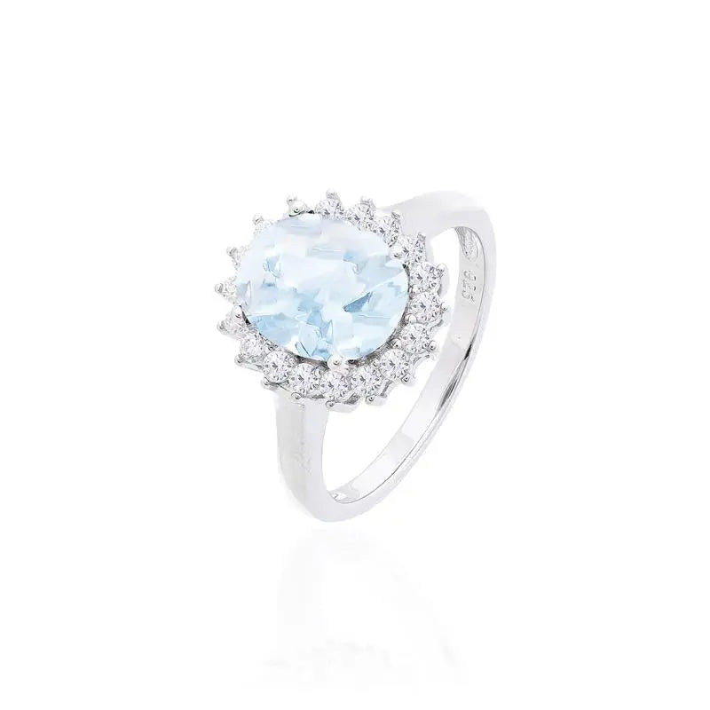 8 MM OVAL SMOOTH RING WITH PRINCESS SETTING AROUND RHODIUM/AQUAMARINE/WHITE ZIRCONIA