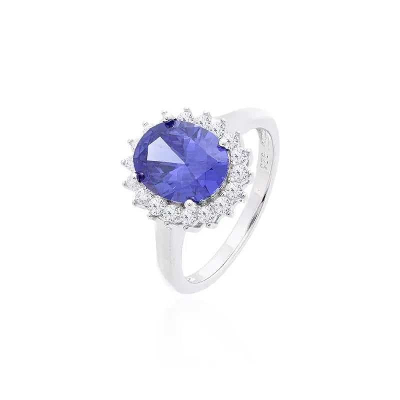 8 MM OVAL SMOOTH RING WITH PRINCESS SETTING AROUND RHODIUM/TANZANITE/WHITE ZIRCONIA