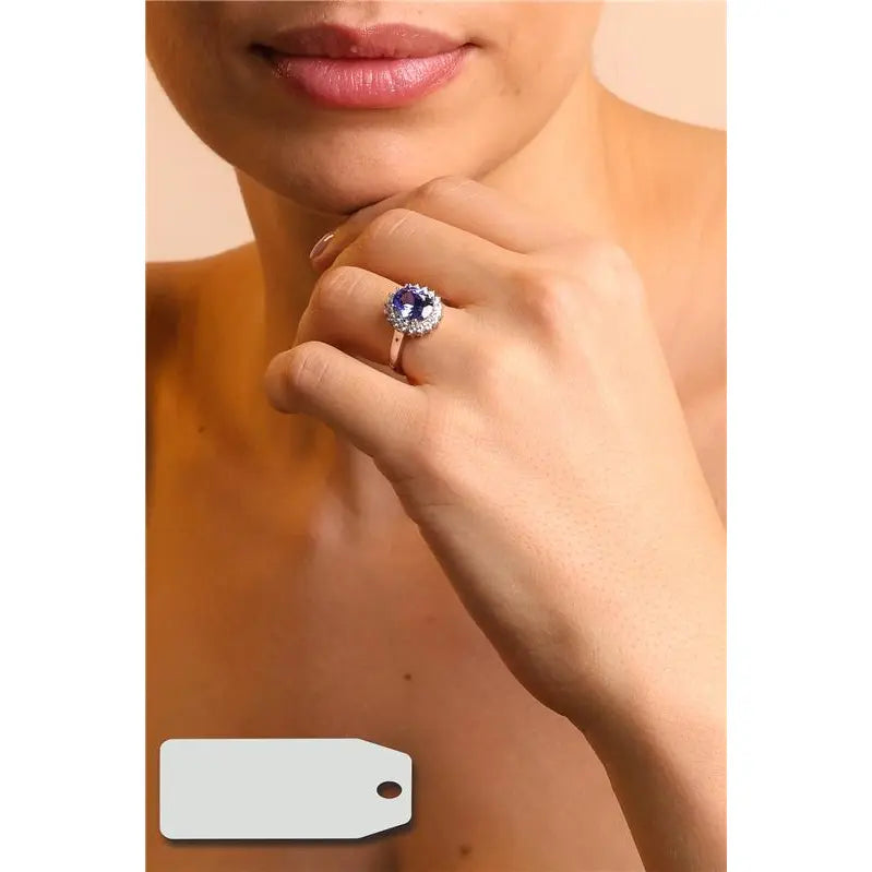 8 MM OVAL SMOOTH RING WITH PRINCESS SETTING AROUND RHODIUM/TANZANITE/WHITE ZIRCONIA