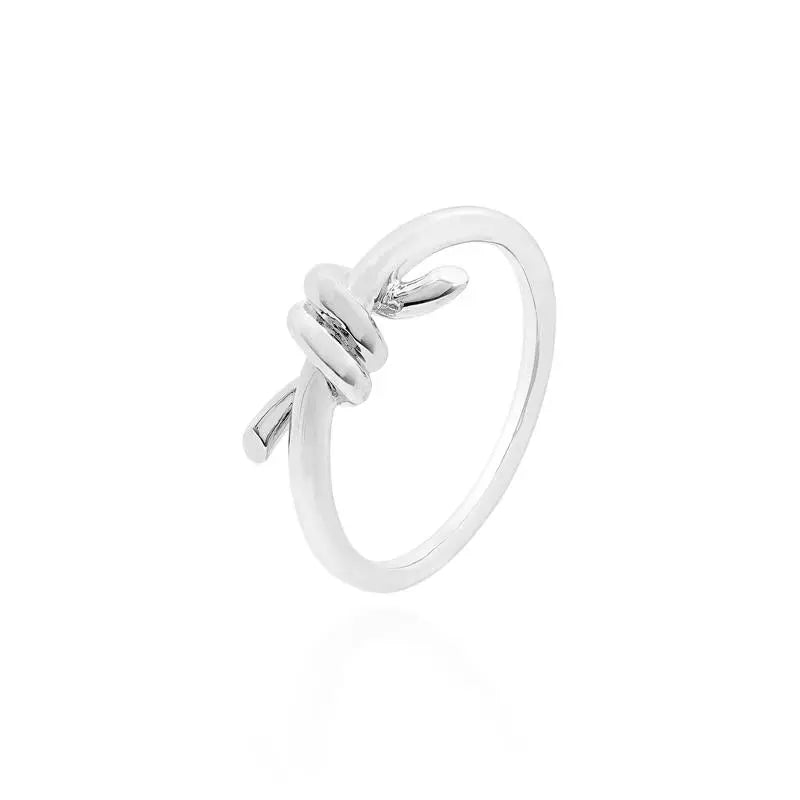 SMOOTH RING WITH RHODIUM CENTRAL KNOT/WITHOUT STONE/SMOOTH
